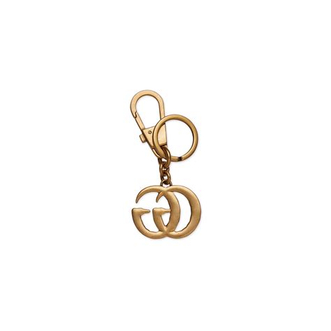 gucci double g pearl keychain with keys on it